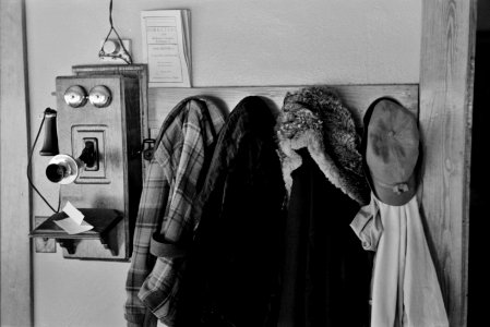 Garments hanging near telephone in Rustan brothers' farm near Dickens, Iowa, December 1936.