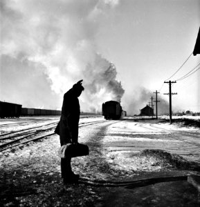 It's Been Good to Know Ya: Wolfsmith waves good-bye. Freight ops of the Chicago & Northwestern RR between Chicago and Clinton, Iowa. January 1943.