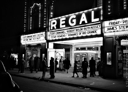 Celluloid Palace: Scene outside a movie theater on the Southside of Chicago, Illinois. April 1941.