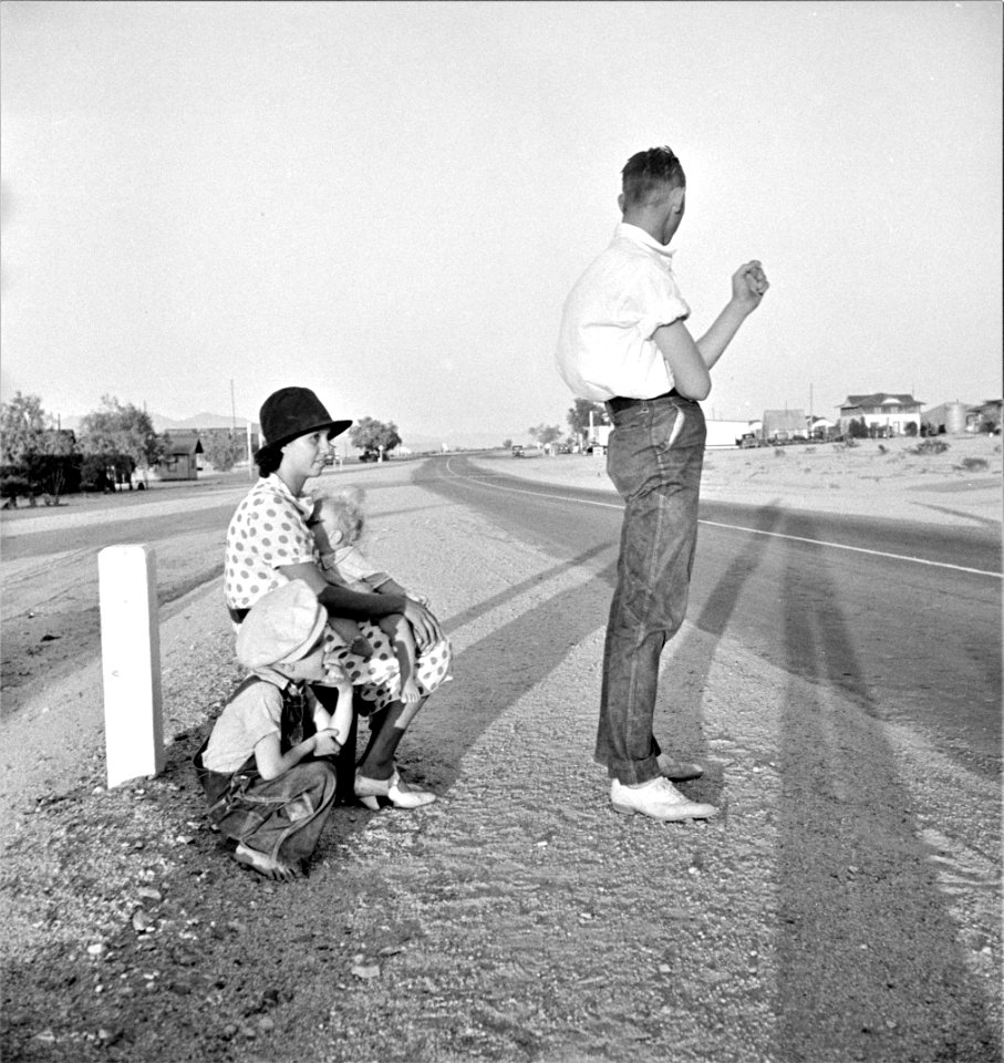 We of the Long Road: Example of self-resettlement in California. Oklahoma farm family on highway between Blythe and Indio, August 1936.