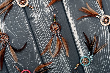 Dreamcatchers on a wooden background photo