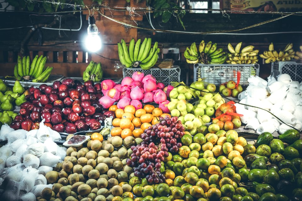 Variety of fresh fruits on organic food night market. Bali island, Indonesia.