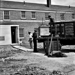 First Black family moving into the Sojourner Truth neighborhood, Detroit, Michigan, 1942.