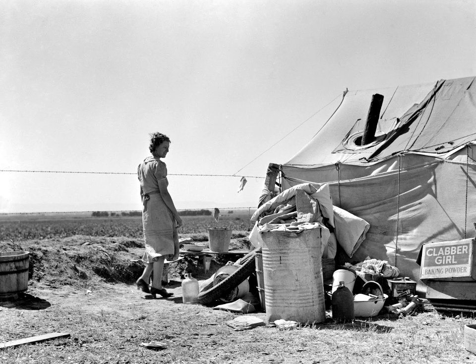 Hard Times: Young family just arrived from Arkansas camped along the road. Imperial Valley, California, Spring 1937.