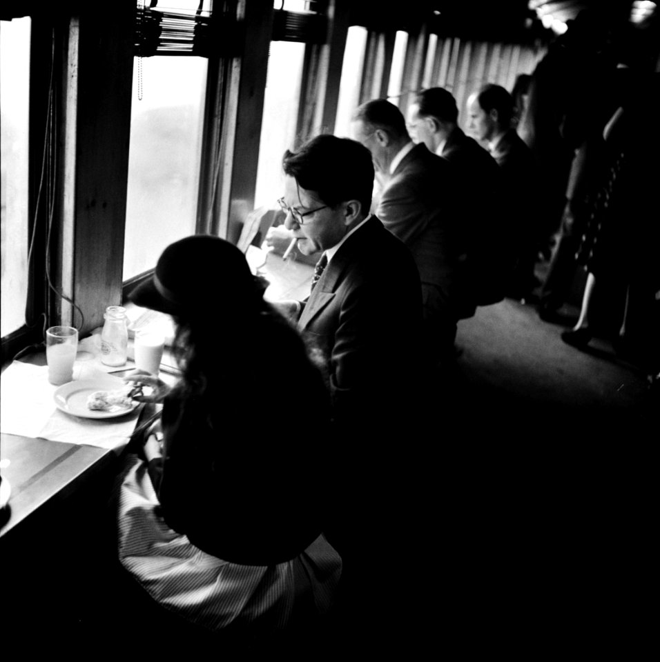 Breakfast & Conversation: Commuters on a train to New York City. October 1941.
