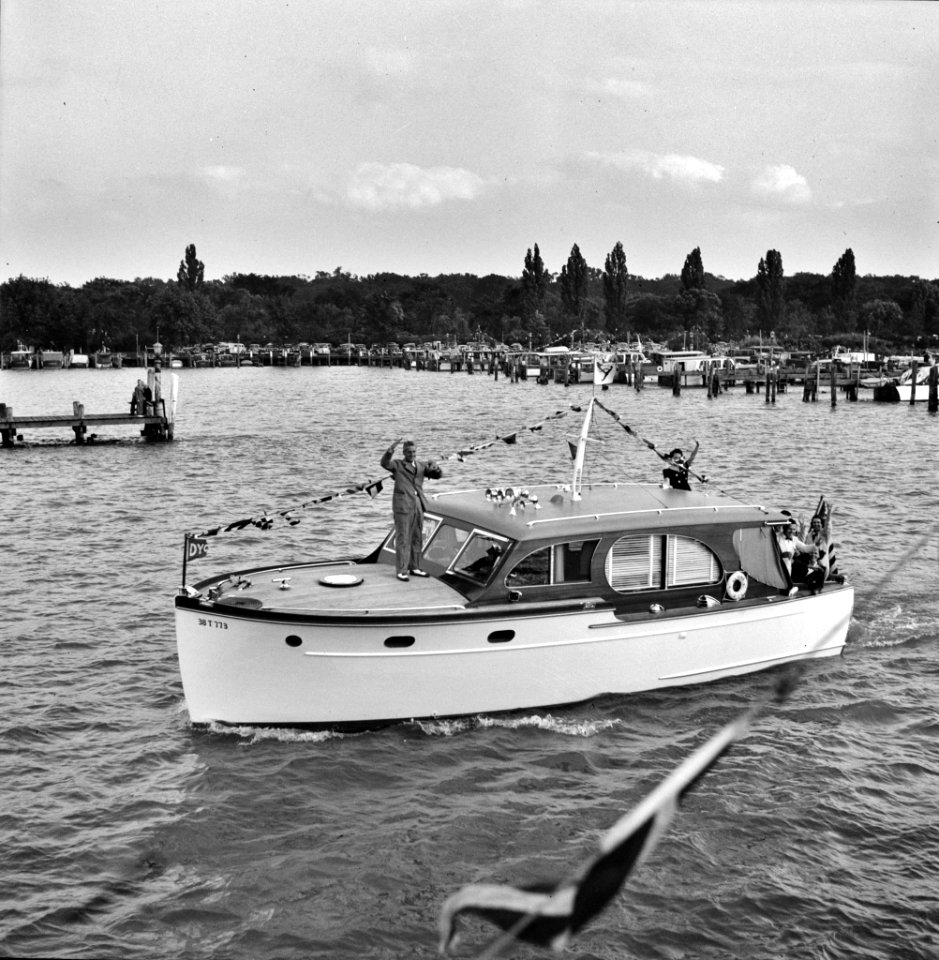 A Venetian night party at the Detroit yacht club, whose members represent the wealthier class of manufacturers and their friends. Small cabin cruiser. Summer 1940.