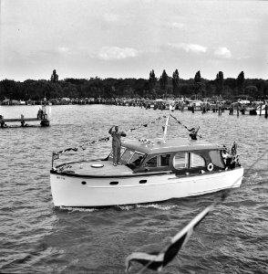 A Venetian night party at the Detroit yacht club, whose members represent the wealthier class of manufacturers and their friends. Small cabin cruiser. Summer 1940.