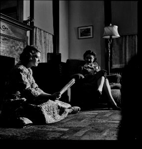 Reading by Shadows: Washington, D.C. Girls employed by the U.S. government in a room selected for them by the Office of Emergency Management (OEM) personnel service. March 1943.