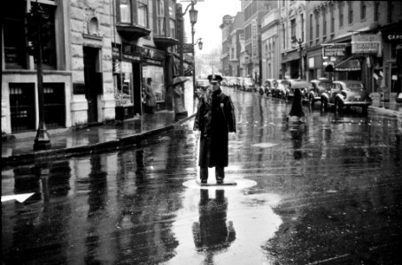 Traffic Cop: Street scene on a rainy day in Norwich, Connecticut. November 1940