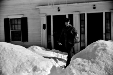 Mailman making deliveries after a heavy snowfall. Woodstock, Vermont, 1940.