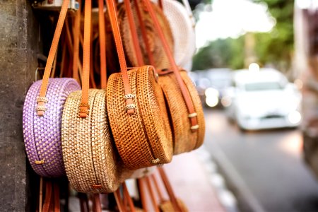 Stylish rattan handbags on the balinese street in Ubud. photo