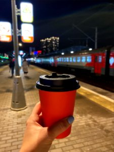Red paper coffee cup at night photo