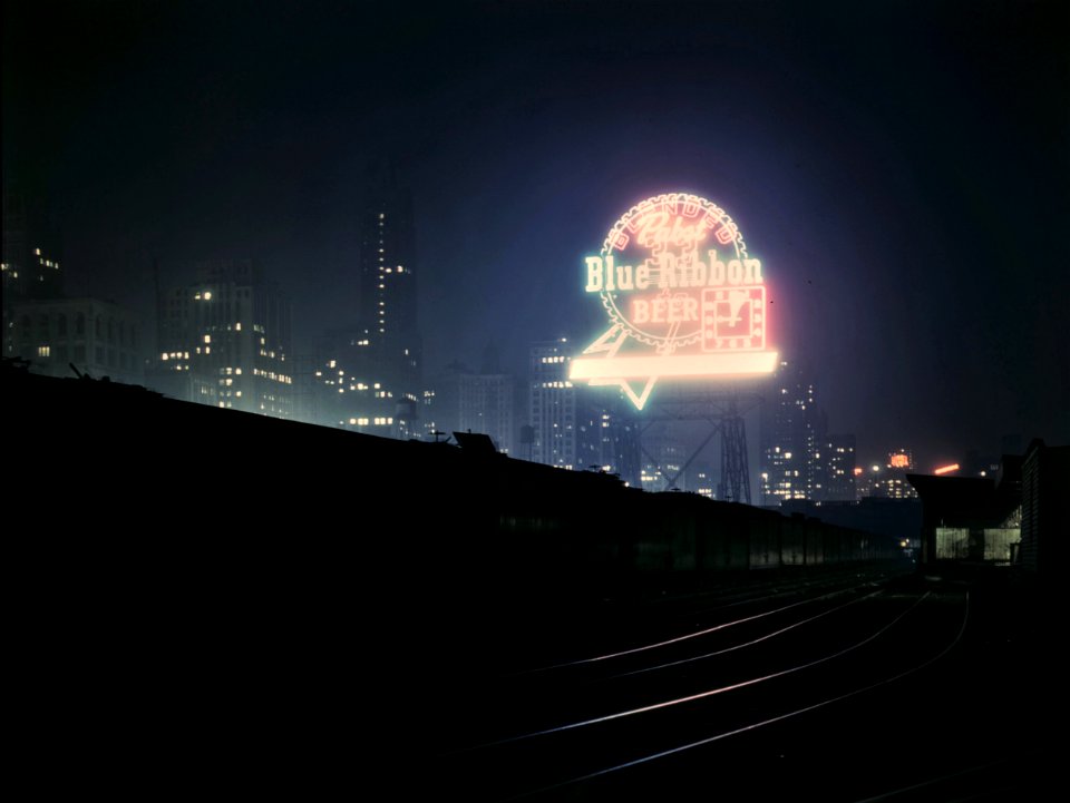 Night Light: Illinois Central Railroad freight cars in South Water Street freight terminal, Chicago, Illinois. April 1943.