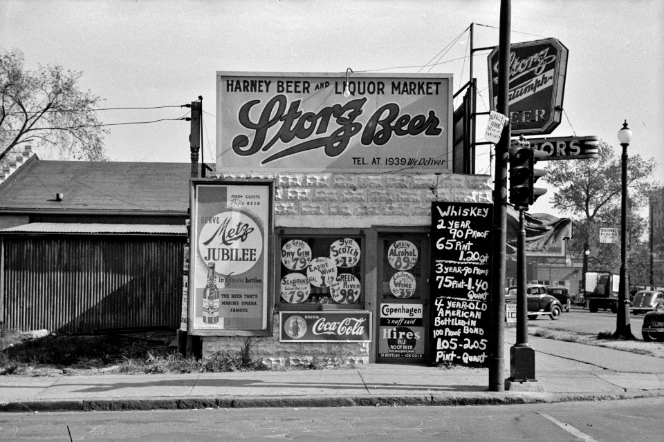 Corner Jubilee: Liquor store in Omaha, Nebraska, November 1938.