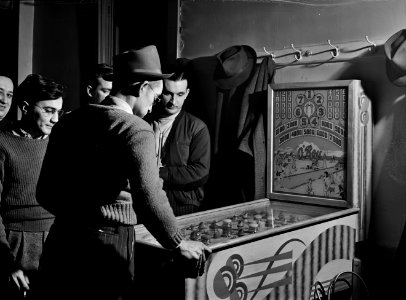 Gamers 1941: Playing the pinball machine at the steelworkers' Serbian Club in Aliquippa, Pennsylvania, January 1941. photo