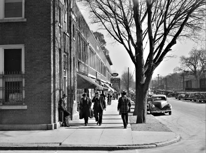Just Off Main: Sidewalk traffic on main street on the day of tobacco auctions in Mebane, North Carolina. November 1939.