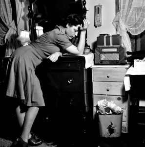 Murder, He Says: Listening to a murder mystery on the radio in a boardinghouse room. Washington, D.C., 1943. photo