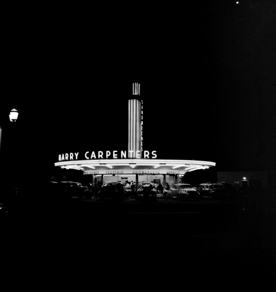 Harry's Place: A neon sign at a drive in resteraunt. Hollywood, California.  April 1942.