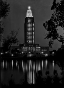 Louisiana State capitol, Baton Rouge, Louisiana. Tower lights at night, reflected in lake. Sept 1932.