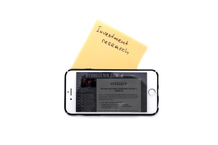 Investment research sticker and iphone photo