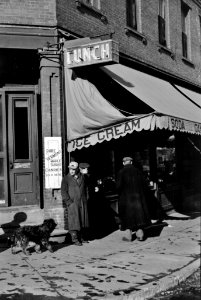 Corner Lunch: Townspeople discussing the severe winter on the street corner in center of town in Woodstock, Vermont, 1940.