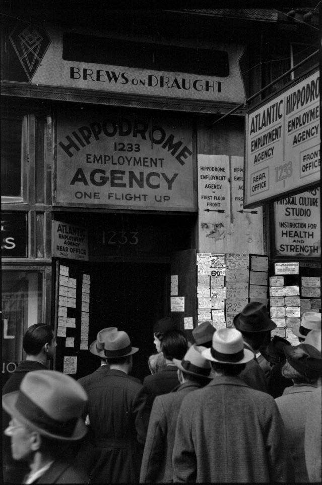 The Searchers: Long lines outside of an employment agency on Sixth Avenue, New York, New York 1937.