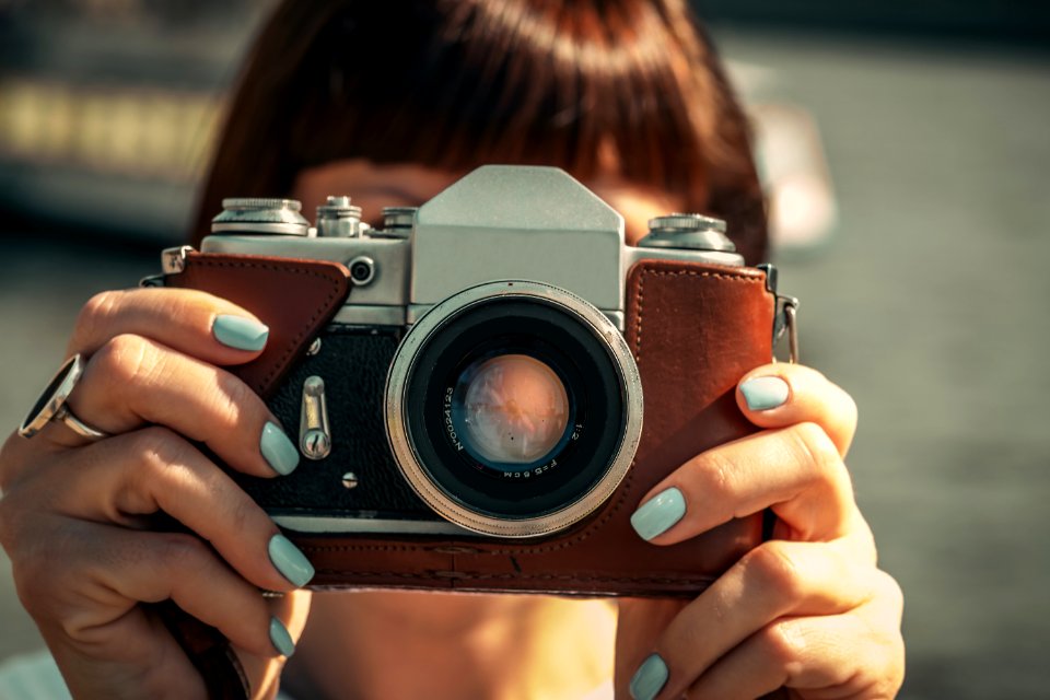 Woman with vintage camera