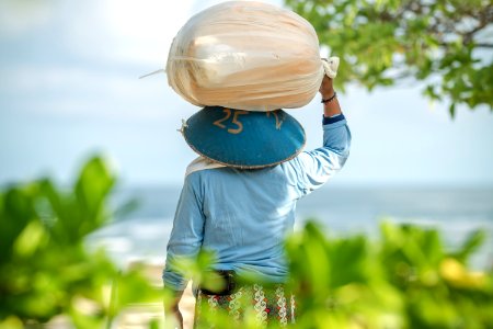 Beach worker on Bali island