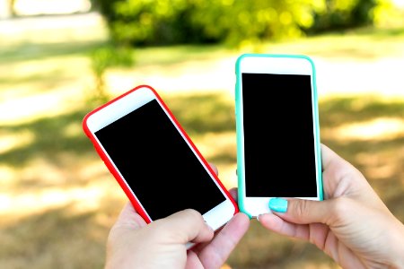 Two smartphones, blank screen photo