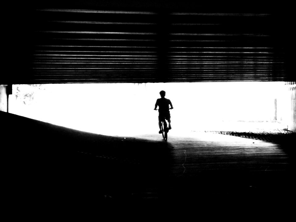 cycling through tunnel silhouette