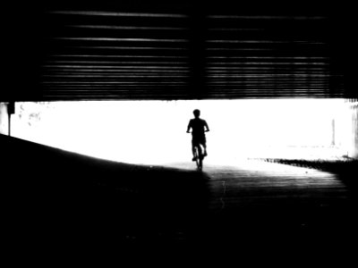 cycling through tunnel silhouette photo