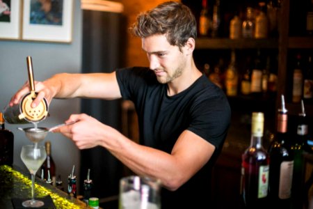 Bar staff, bartenders, bar man, mixologist, cocktail maker photo