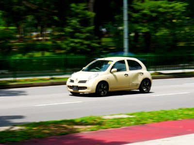 dented small car on the road photo