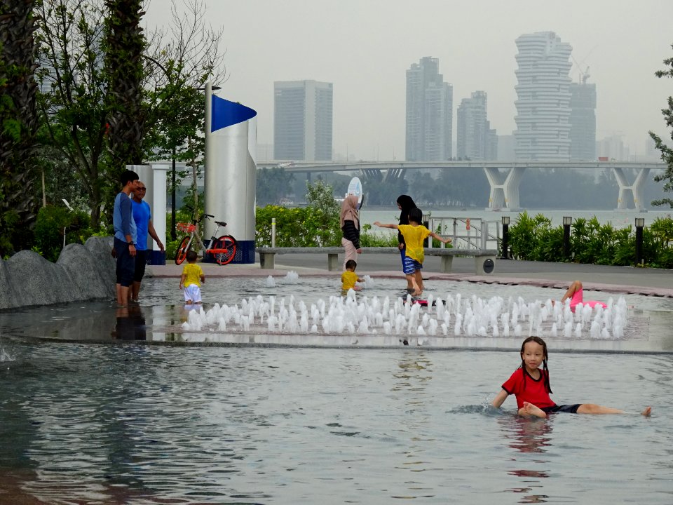 28 kids and adults enjoying the water features