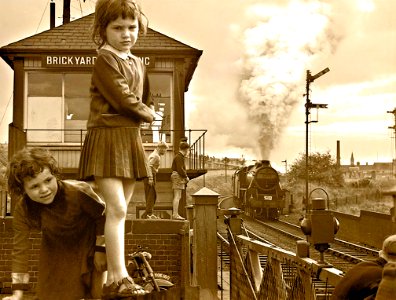 Brickyard Crossing England. We lived not far from the crossing gates, when we heard the sound of a train approaching, we would run and climb on the gates to watch it pass