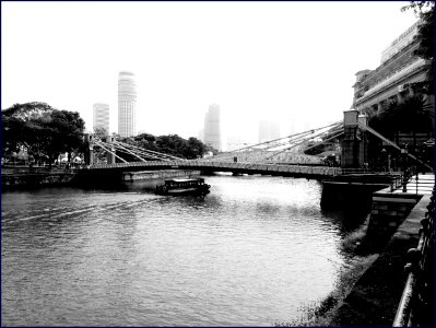 boat passing through bridge photo