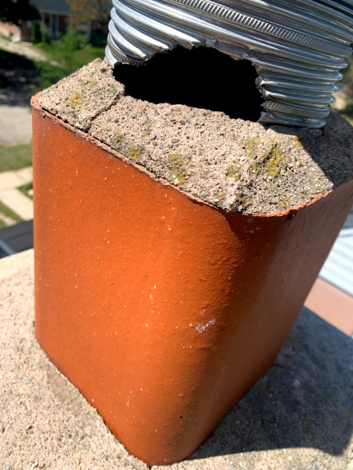 Damaged chimney vent by squirrel