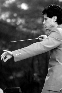 Jorge Luis Uzcátegui, assistant conductor of the Spokane Symphony, performing in Pavillion Park in Liberty Lake, WA. photo