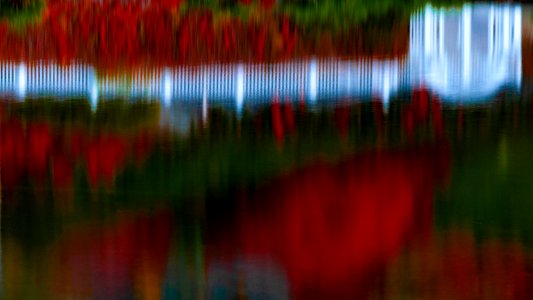 White picket fence reflections in Black Bay Park, Post Falls, ID.
