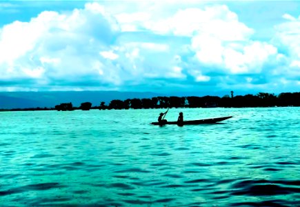 Two Girls Boating on Tanguar Haor in Rain photo