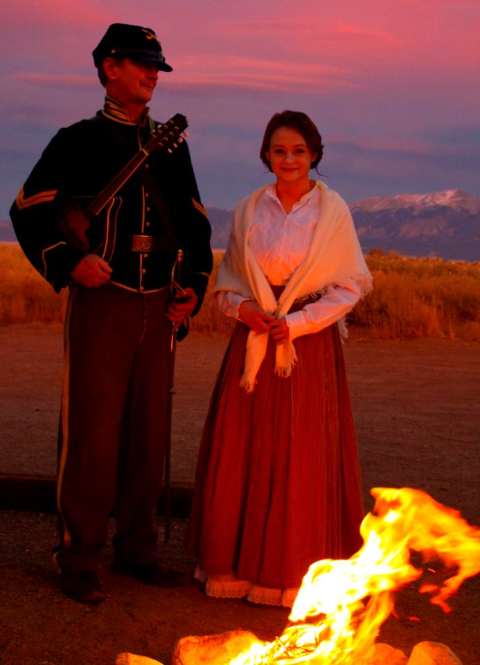 Living History: A Cavalry Soldier and His Daughter by a Campfire