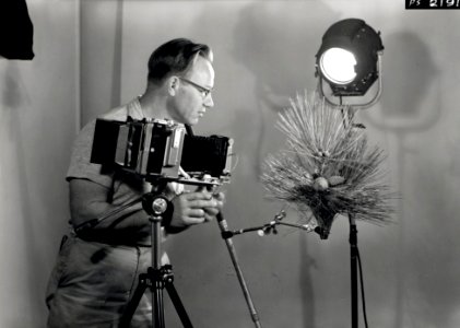1958. Photographer Wally C. Guy using Linhof Technika camera in the lab. Sellwood Lab. Portland, OR. photo