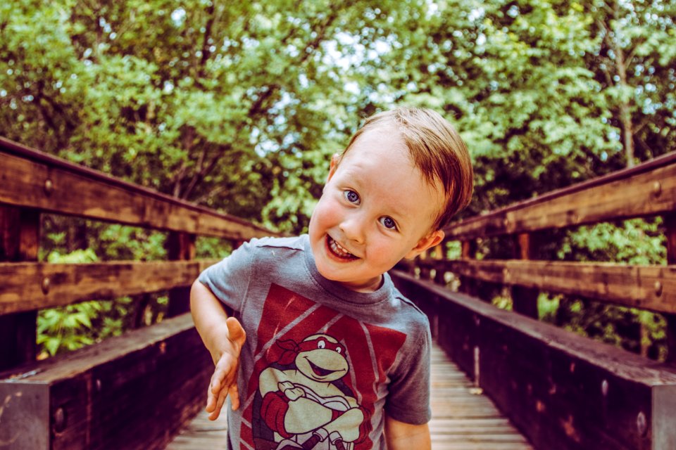 Cute Kid on a Bridge - His Go To Expression