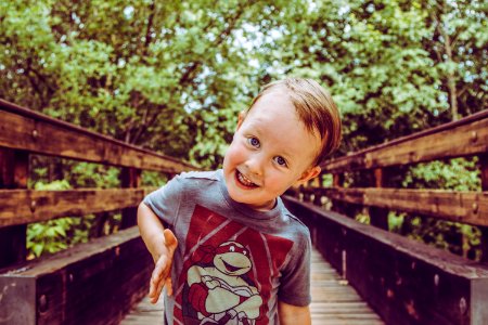 Cute Kid on a Bridge - His Go To Expression photo