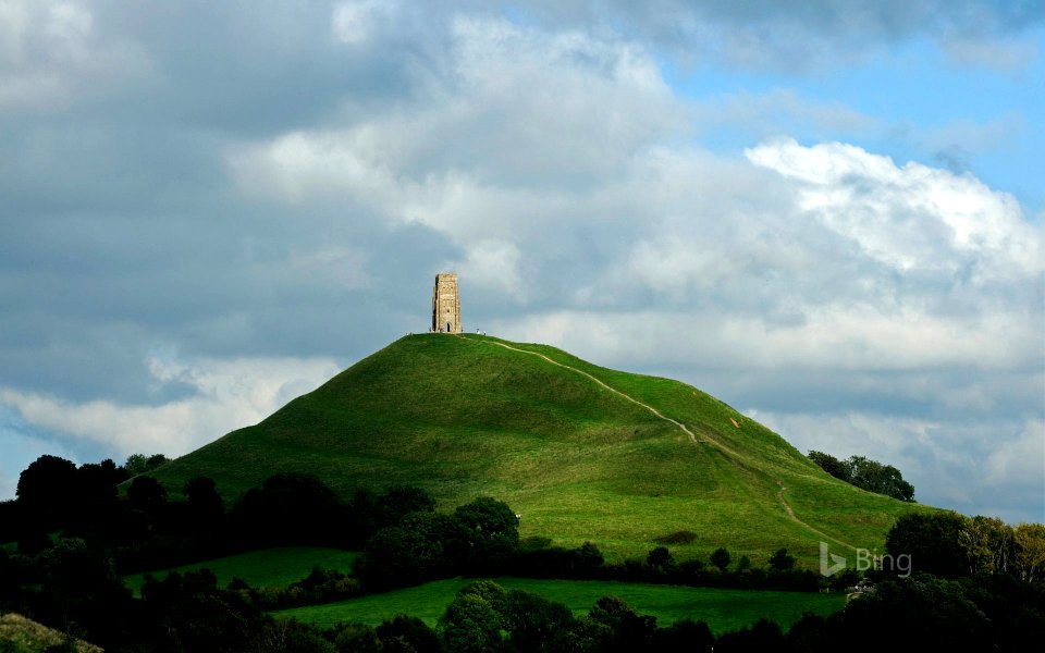 Glastonbury Tor and St Michael's Tower in England for the start of the Glastonbury Festival