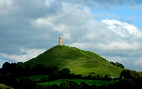 Glastonbury Tor and St Michael's Tower in England for the start of the Glastonbury Festival photo