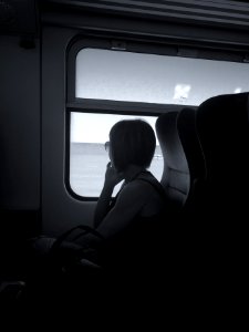 Woman in train, thinking about ...