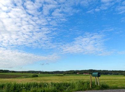 Mailbox under altocumulus clouds photo