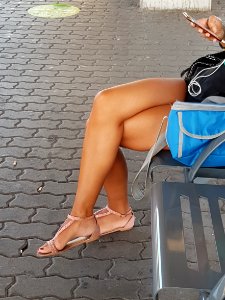Beauty girl with crossed Legs and arches feet photo