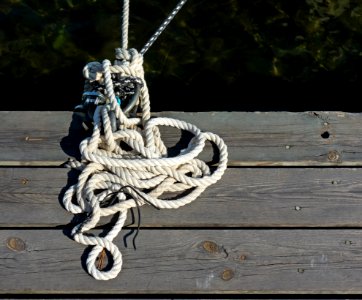 Untidy white rope on a jetty photo